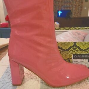 Pink patent boutique boots.  Beautiful color.